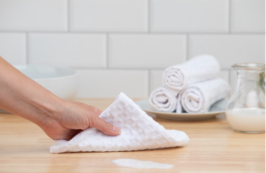 White recycled cotton waffle weave dishcloth used in kitchen